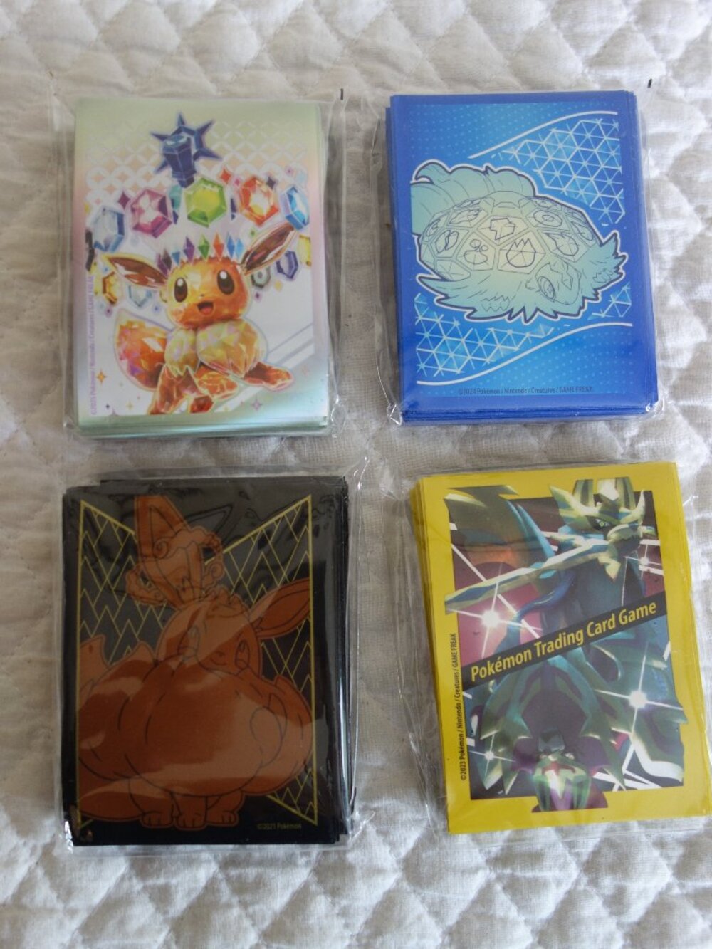 (b)	Lot of 4 NIP 65 count ea POKEMAN Trading Card Sleeves